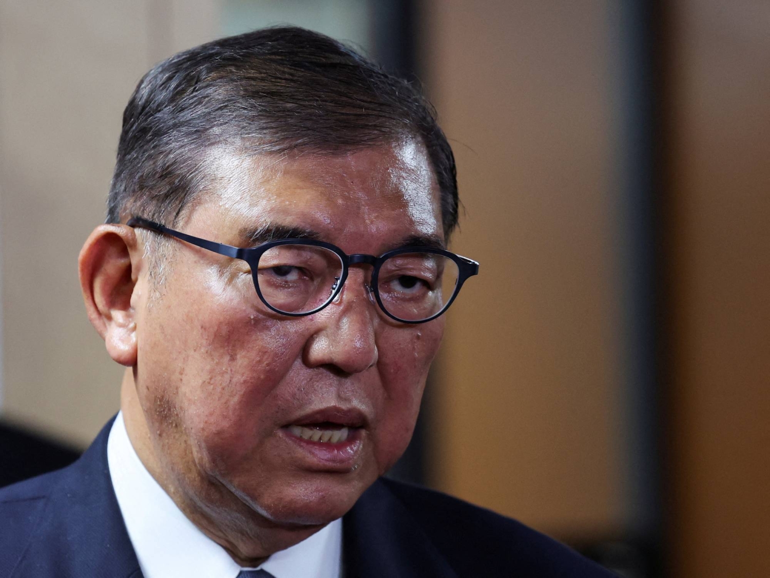 Prime Minister Shigeru Ishiba speaks to the media after a meeting in Tokyo last month.