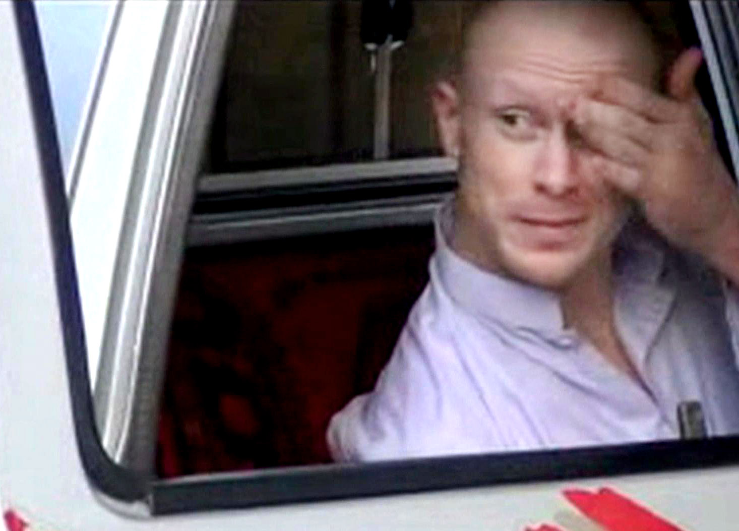 A video still obtained from Islamist website Voice Of Jihad shows Sgt. Bowe Bergdahl sitting in a vehicle prior to his release on Saturday. The video has been authenticated based on its contents. | AP