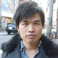 Simon Tan, English teacher, 25 (Chinese-American): When I first got here it was to improve my Japanese and stop being shy. That worked, as now I organize meetups. I don\'t break resolutions as I don\'t make many. This year I aim to get stronger — to go to the gym. Also, to do a one-hand handstand — but in fact I can do that now! | JON MITCHELL