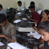Indian candidates use typewriters during the last official typing exam conducted by the state government in Mumbai on Monday. Typewriters have largely been consigned to history in many countries, and high-tech India might soon join the list as its shift to globalization and mastery of the latest computer technologies drives its economic boom. | AFP-JIJI