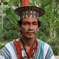 Benki Piyako, an Indigenous spiritual leader of the Ashaninka people of the Amonia River, is a renowned environmentalist and human rights activist. | ELIANE FERNANDES